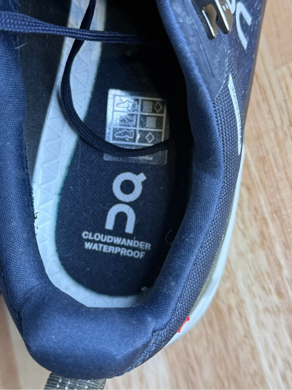 On Waterproof Men's Trail Shoes in midnight blue and Olive